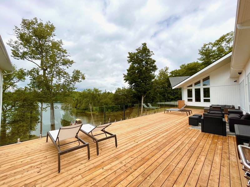 Expansive lakeside deck with seating