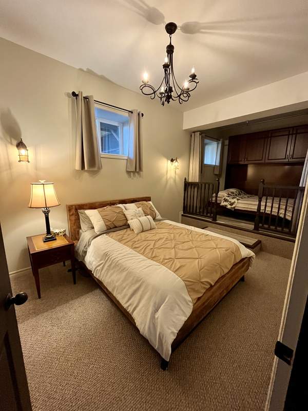 Room 4 — Suite with African queen bed & double bed with privacy curtain